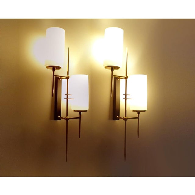 Exceptional pair of very large french, architectonic sconces by lunel, paris, circa 1965, asymetric brass stucture with...