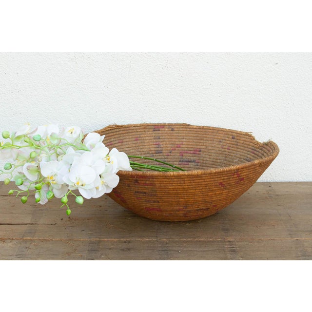 At a sprawling 27 inches wide, this oversized nomadic winnowing bowl is a spectacular piece of functional tribal art. In...