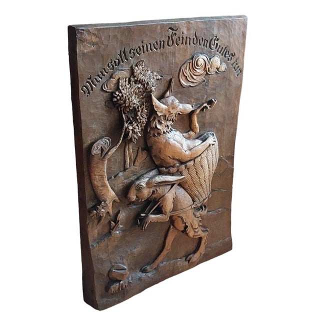 A beautiful large and solid walnut wall decoration. A very beautiful depiction of a hare carrying a wolf. " Man soll...