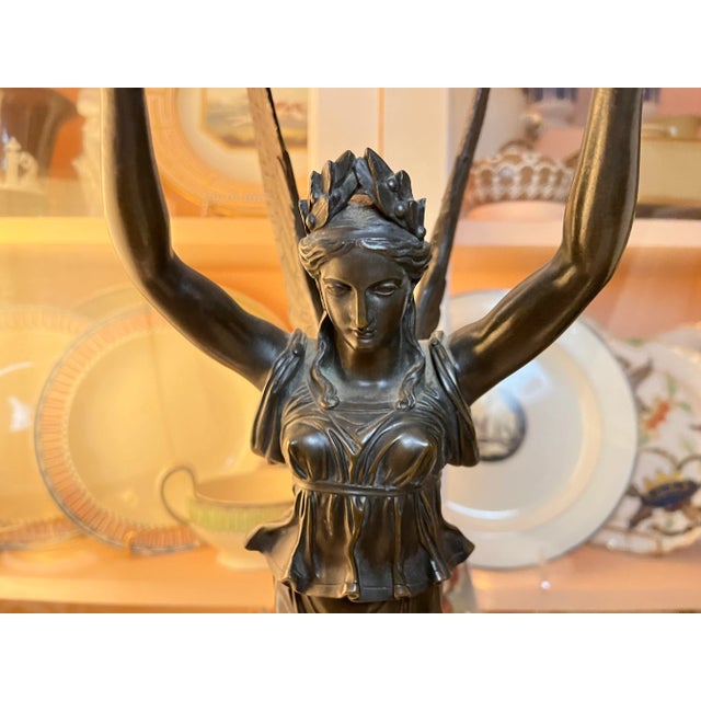 Empire ormolu and patinated bronze six-branch candelabra attributed to Pierre Philippe Thomire, circa 1805. A winged...