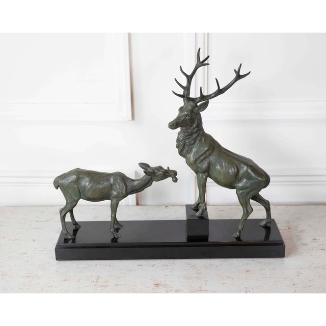 A striking Louis-Albert Carvin sculpture depicting a stag and doe with remarkable movement and naturalistic detail. Known...