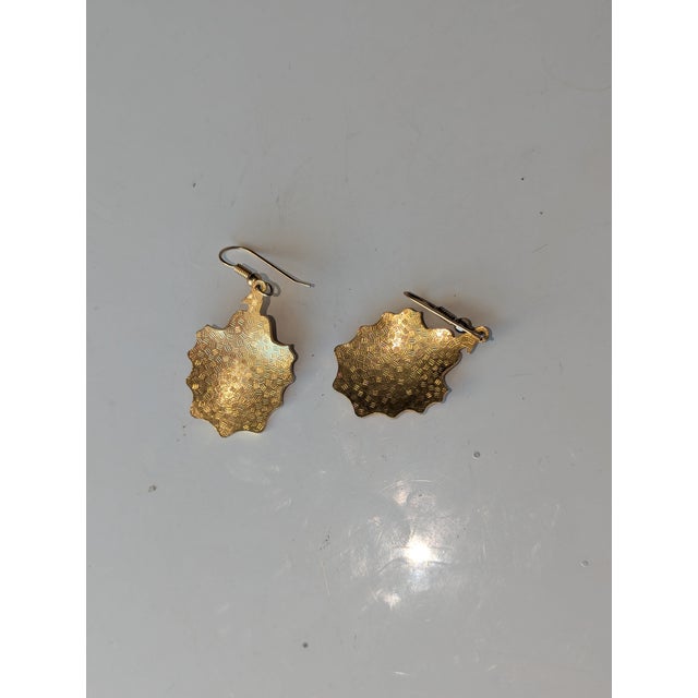 Sometimes mistakenly referred to as peacock, these earings are of the late 20th century