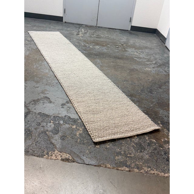 Design Plus Gallery presents the 2ft 4in × 11ft 8in Safavieh Silver Natura Runner Wool/Cotton Rug. It is hand-woven on a...