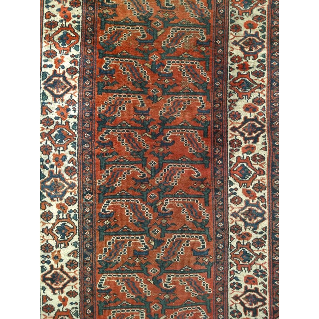 "This Malayer runner from the early 20th century is a piece of quiet, enduring beauty — an overall design of repeated tree...