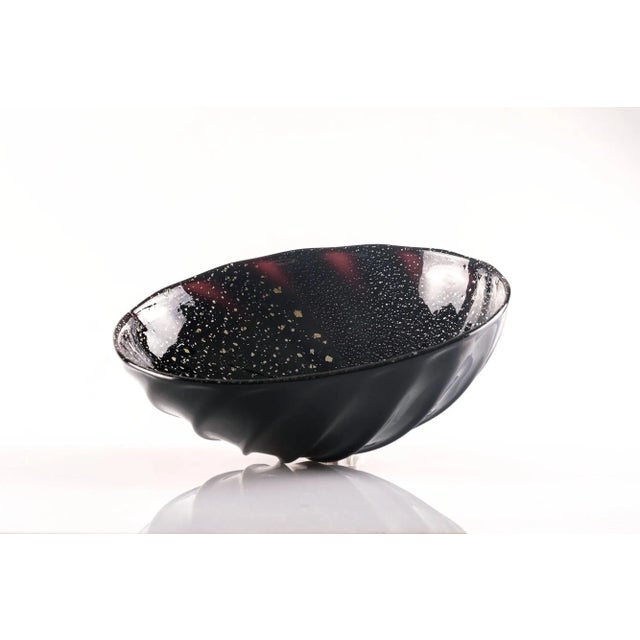 Splendid Arabesque Bowl in Murano Glass with silver inclusions. Etched signature G.Barbisan, Murano This piece has an...