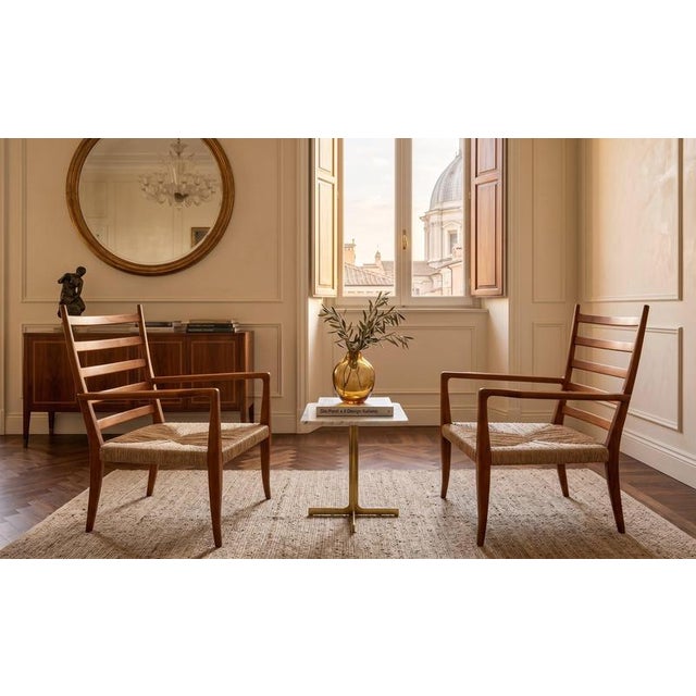 A rare pair of sculptural armchairs by architect and designer Gio Ponti, they embody the essence of 1950s light elegance....
