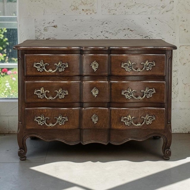 An elegant expression of Country French cabinetmaking, this antique solid oak commode draws its sculptural lines from the...