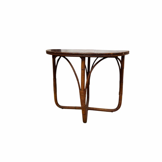 Vintage mid century round bamboo side table. Bamboo legs wood top. Top has some age related shrinkage between the center...
