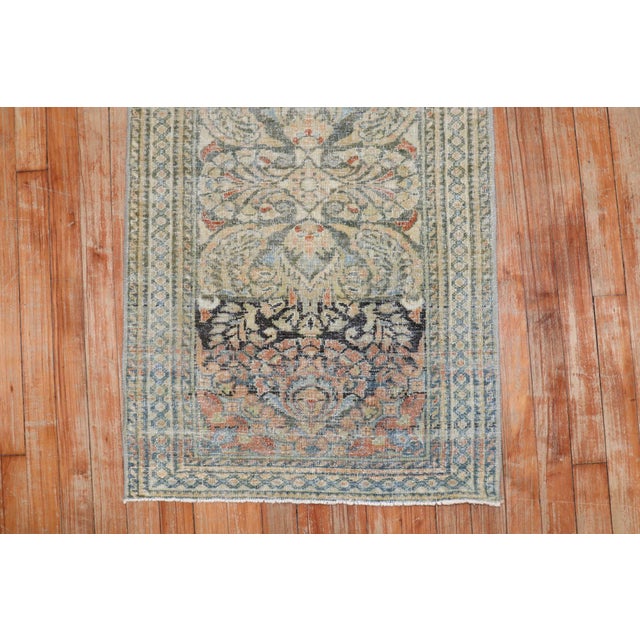 An early 20th century Worn Persian Lilihan Mini Size Rug