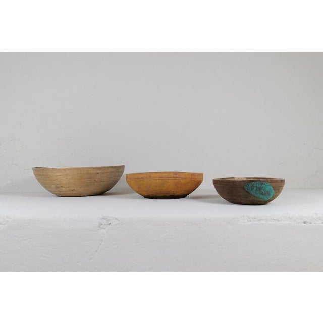Set of 3 antique and unique three sizes organic wooden bowls. with highly appealing patina, with traces of use. Produced...