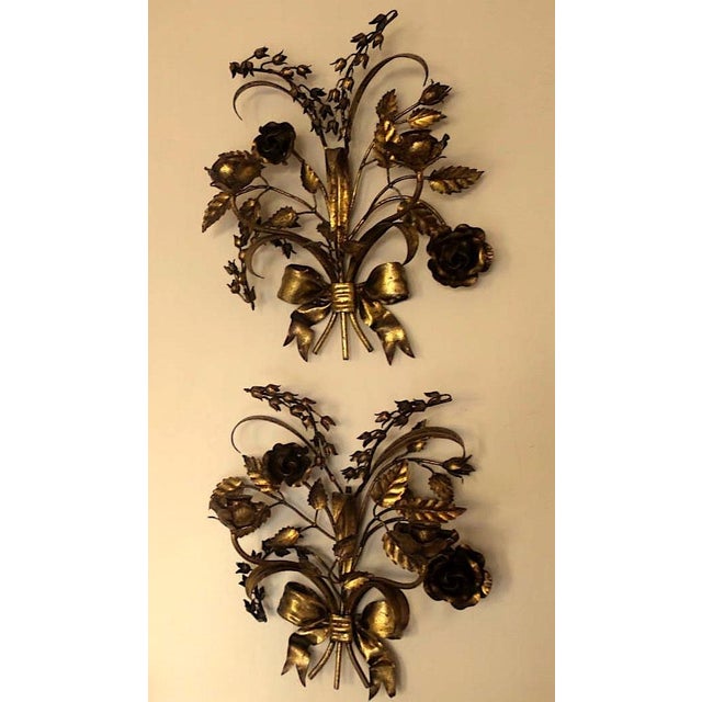 Pair of Hans Kögl gilt tole double candleholder wall lights dating from the 1960s, beautiful patina. Decorated with...