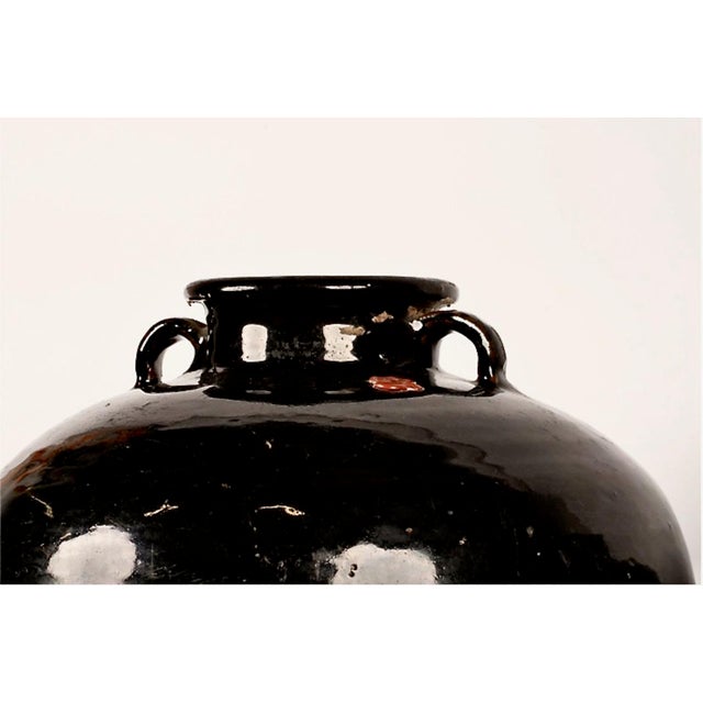 These are impressive black glazed Chinese Late Qing Stoneware Storage Jars that would be at home in an Axel Vervoordt-...