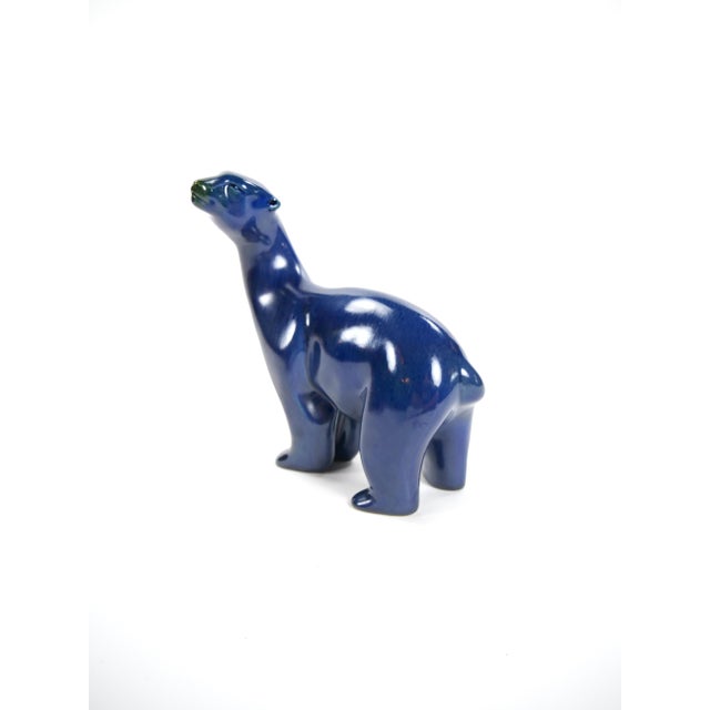This remarkable mid-20th century hand-painted porcelain sculpture showcases a striking polar bear, meticulously crafted...