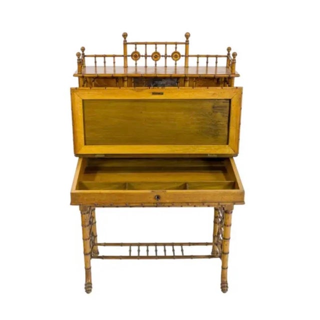 An R.J. Horner American Victorian Faux Bamboo Desk, circa 1880. Desk features an upper structure with an elegant spindle...