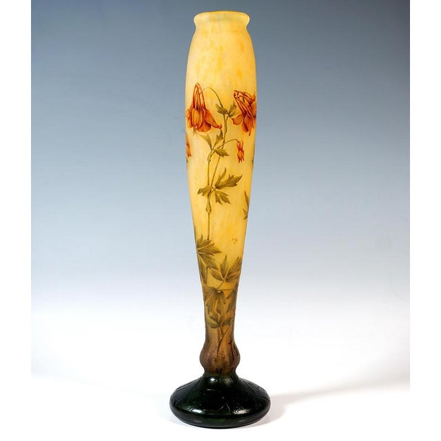 Baluster-shaped vase, on a round base offset by a nodus, with gently curved, slender walls, slight constriction at the...