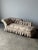 This 19th century Napoleon III antique chaise longue is defined by its sculptural silhouette — a scrolled, deeply button-...