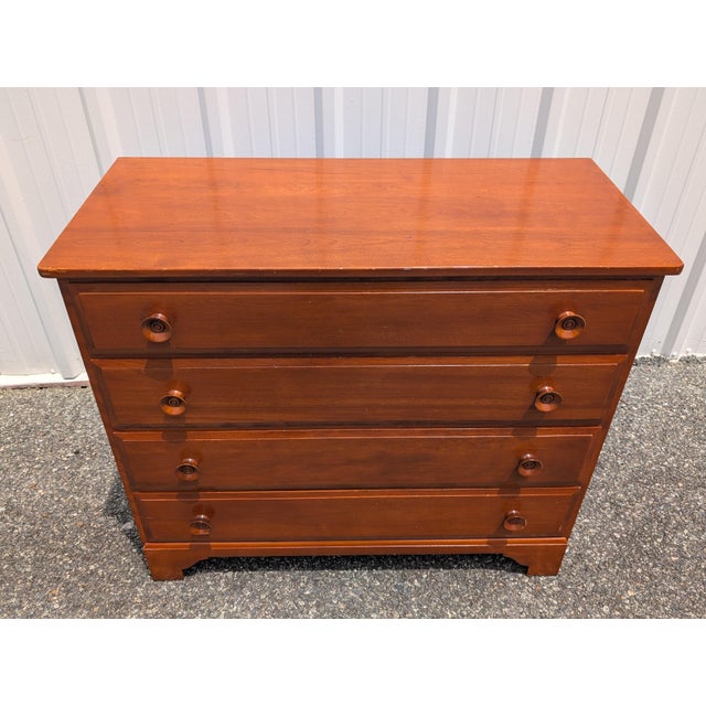 Elevate your space with this vintage Whitney solid cherry wood 4-drawer chest of drawers, a magnificent showcase of...