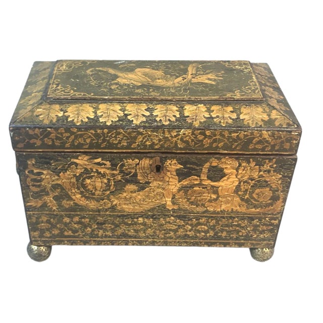This exquisite Regency-era tea caddy is a remarkable example of early 19th-century craftsmanship and design. Its sleek...