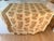 Lee Jofa "Concorde" is a large scale, linen, block print floral in orange, green, and brown tones on a wheat-colored...