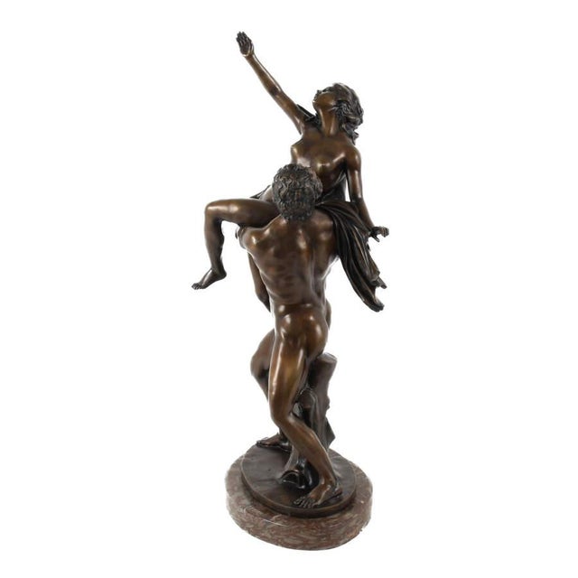 This antique bronze sculpture depicts the dramatic mythological scene commonly known as The Abduction of the Sabine Women,...