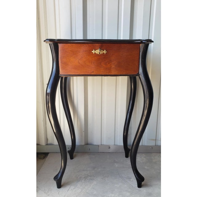 A scarce late Biedermeier period Mid-19th century Rococo Revival accent table gracefully rising on elegant hand carved...