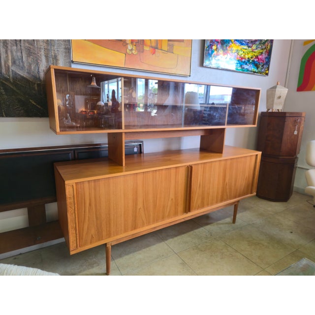 High Quality Vintage Danish Teak 2 Piece Sideboard has upper tier hutch with 2 sliding glass doors and shelves. Credenza...