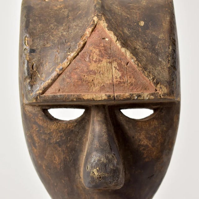 The Kwele Ekuk Mask, a profound cultural emblem hailing from Gabon's Kwele people, represents a key facet of their society...