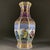 This stunning vase features a classic hexagonal (six-sided) form, with a flared rim and a tapering body. It showcases the...