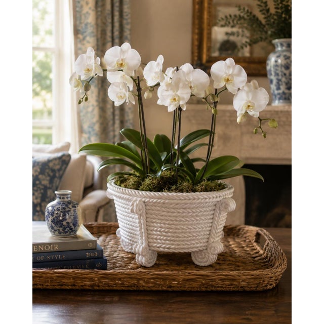 A beautifully sculptural vintage porcelain cachepot modeled in trompe l’oeil fashion as a coiled rope basket. The glossy...