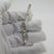 Vintage solid silver figurine depicting a rifle mounted on a pedestal, crafted in italy during the 1970s to 1980s. crafted...