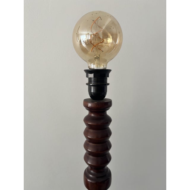 Elegant vintage turned wood floor lamp with a pretty round shelf, combining functionality and old-world charm. Its wooden...