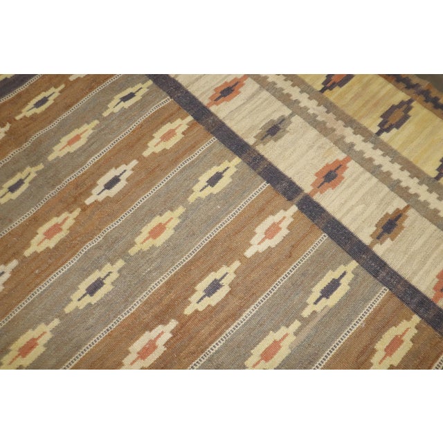 A room size Swedish Kilim from the middle of the 20th Century in rustic tones Measures: 8'3'' x 10'5''