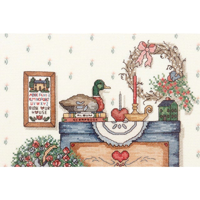 Cross stitch textile art depicts a room scene including it’s own “Bless Our House” sampler. Signed and dated CG ‘89. Set...