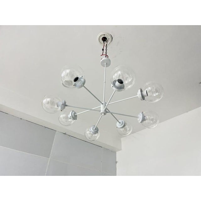 Bring a touch of retro charm to your space with this one-of-a-kind 1950s light. Featuring a modern Italian mid-century...
