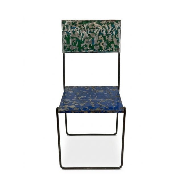 An exceptional and unique conversational piece, this contemporary accent chair is hand-crafted from a repurposed, salvaged...