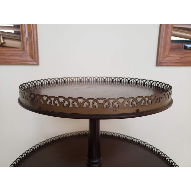 Add a touch of classic sophistication to your home with this charming vintage two-tier side table by the renowned Ferguson...