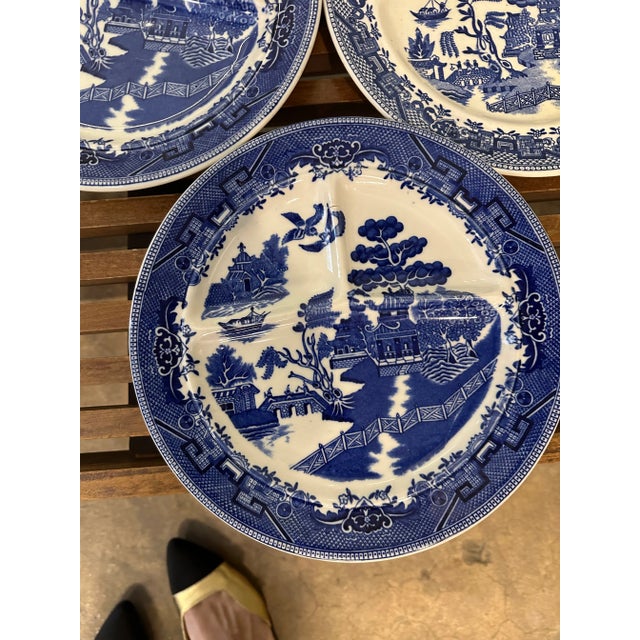 Set of eight mismatched brands, blue and white Chinoiserie - Pagoda style divided dinner plates.