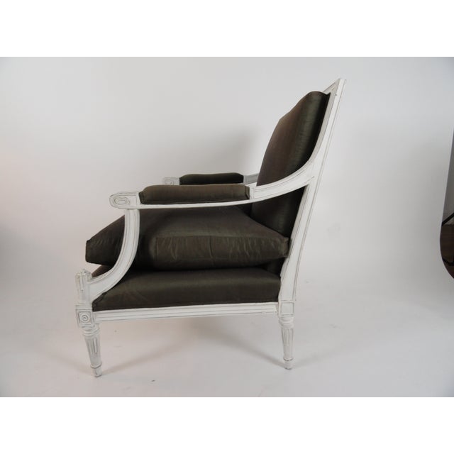 Maison Jansen Louis XVI style armchair or fauteuil. Wood painted white, newer finish, and distressed. Upholstered in Henry...