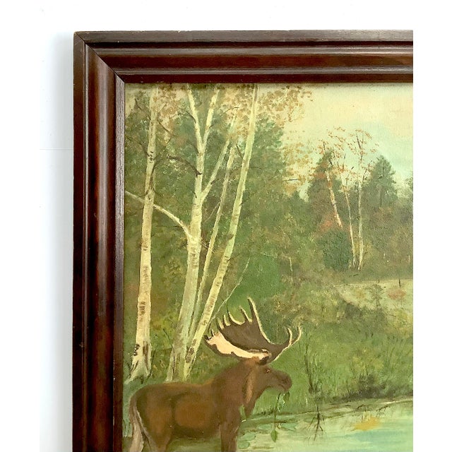 Circa 1930s/40s oil on board with folky moose wading in stream, signed lower right corner "A LaRose". Outside of frame...