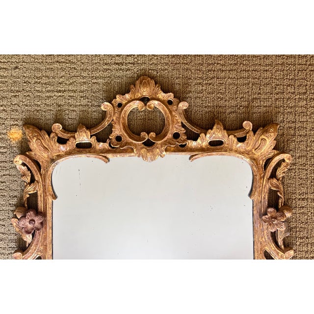Antique 18th century English George III Chinese Chippendale carved giltwood wall mirror. Elegant thin proportion with...
