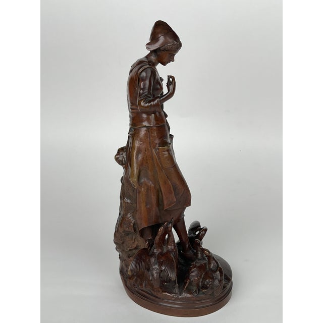 A Patinated Bronze Sculpture Of A Standing Lady Feeding Ducks By Lalouette. France, Circa 1880. This sculpture depicts a...