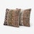 This 24'' x 24'' pillow cover set was made from authentic Turkish rug pieces — navy and olive geometric bands with rust...