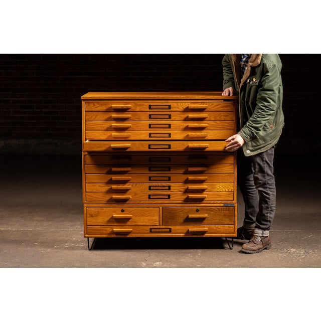 c. 1970s-1980s; Mayline Company, Inc. - Sheboygan, WI Substantial oak flat file cabinet with a stepped modular case form,...