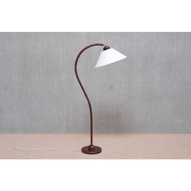 This floor lamp was produced by markslöjd in kinna, sweden, in the 1960s. It bears the markslöjd label and model number on...