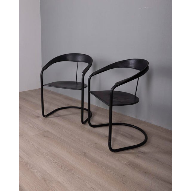Pair of black metal chairs with black leather seats, "Canasta" model, designed by Arrben Italy, 1970s. I have official...