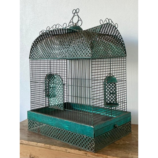 This exquisite vintage birdcage is a masterful celebration of Chinoiserie design and bohemian charm. Crafted from durable...