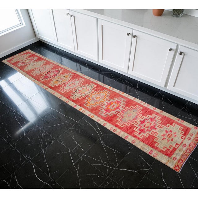 This exceptional 1970s runner, hand-knotted in Southeastern Anatolia, brings a vibrant, soulful narrative to contemporary...