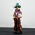 This polychrome plaster sculpture, depicting a cowboy, is an example of artistic production from the 1960s. Branded ILPA...