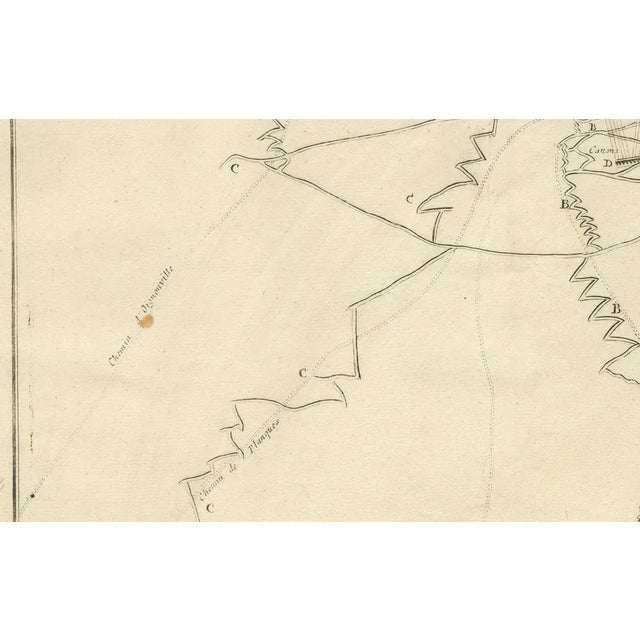 This engraved military map shows the detailed plan of attacks on the fortress city of douay (douai) in northern france,...