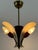 Extremely rare, elegant and highly decorative mid-century modern ceiling lamp or pendant light with three metal reflector...